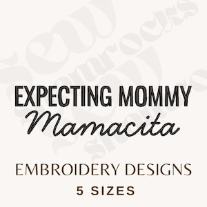 May include: A white background with the words "EXPECTING MOMMY Mamacita" in black, stylized text. Below, the text "EMBROIDERY DESIGNS" and "5 SIZES" are in a brown font. The design is for embroidery.