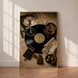 May include: A framed wall art print featuring a black vinyl record labelled After Dark, a martini glass with two olives, a glass of whiskey with ice, a matchbox labelled Le Club Jazz Bar, a gold lighter, a small bowl of olives, and a folded napkin.
