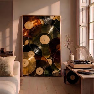 May include: A large rectangular framed wall art print featuring a collage of overlapping translucent vinyl records in shades of amber, gold, green, and black. Each record has a central label with text including Sunday Morning, After Hours, and Noir.
