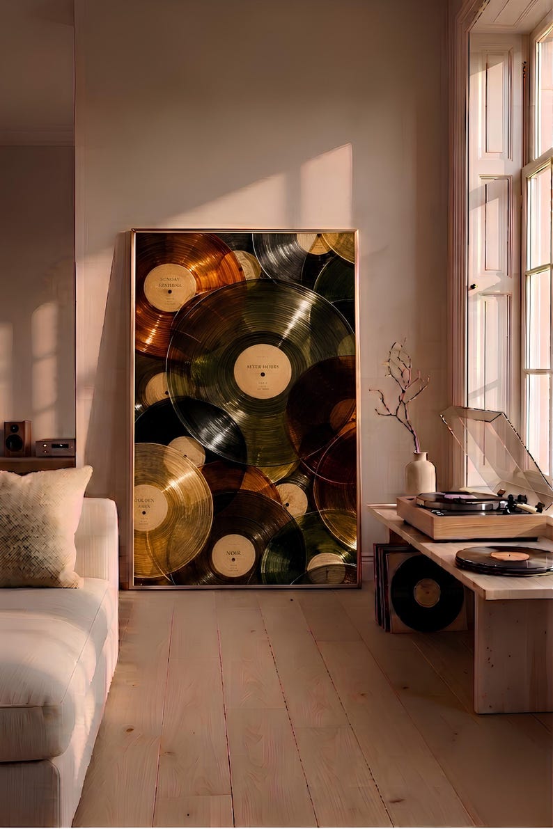 May include: A large rectangular framed wall art print featuring a collage of overlapping translucent vinyl records in shades of amber, gold, green, and black. Each record has a central label with text including Sunday Morning, After Hours, and Noir.