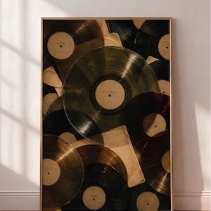May include: A framed wall art print featuring a collage of overlapping translucent vinyl records in shades of amber, olive green, and deep burgundy. Each record has a central beige label with printed text, including the words After Hours and Noir.