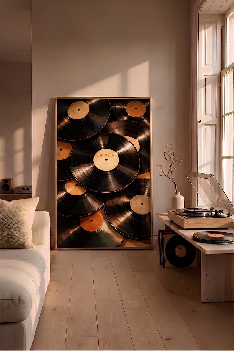 May include: A rectangular framed wall art print featuring a stacked arrangement of black vinyl records with tan center labels. One central label clearly displays the text High Fidelity. The artwork is displayed in a thin metallic frame.