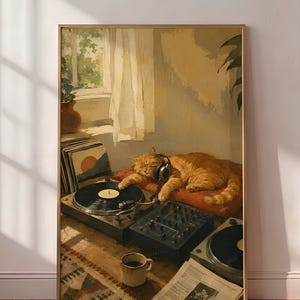 May include: A framed wall art print depicting an orange tabby cat wearing headphones, resting on a cushion next to a turntable, a mixer, a stack of vinyl records, a coffee mug, and a newspaper, all set in a sunlit room with a window.