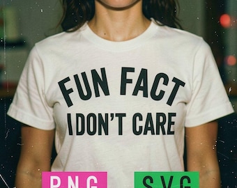May include: Cream-colored t-shirt with the text "FUN FACT I DON'T CARE" in bold black letters. The shirt also has pink and green rectangular graphics with the letters "PNG" and "SVG".