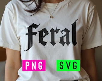 May include: White t-shirt with the word "Feral" printed in black gothic font. The shirt has a pink "PNG" and green "SVG" label below the text.