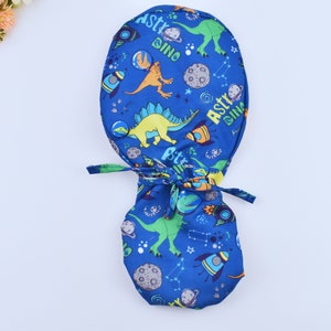 Space Dinosaurs Surgical Scrub Cap, Surgical cap women. Satin Lined Option Surgical cap with ponytail, Satin lined scrub cap.