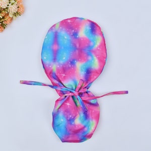 Galaxy, Women&#39;s European Style Surgical Scrub Cap, Floral Print, Satin Lined Option Surgical cap with ponytail. Satin lined scrub cap.