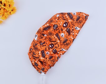 Czapeczka chirurgiczna z kucykiem w kształcie duchów na Halloween: Upiorny pomarańczowy czepek chirurgiczny