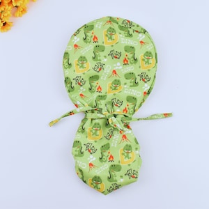 Dinosaur Ponytail scrub cap, Surgical cap women. Satin Lined Option Surgical cap with ponytail. silk lined scrub cap.