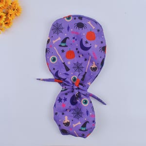 Halloween Ponytail scrub cap, Evil eye Scrub caps, surgeon Surgical cap, Pumpkin scrub caps for Women, Satin lined Scrub Cap,