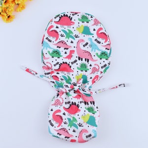 Dinosaur Ponytail scrub cap, Surgical cap women. Satin Lined Option Surgical cap with ponytail. silk lined scrub cap.