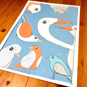 May include: A colorful illustration of a group of birds with different colors and shapes. The birds are on a blue background with white accents. The birds are all looking in different directions.