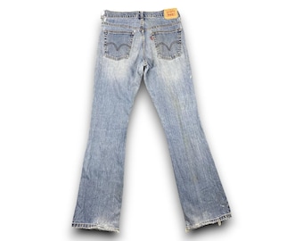 Vaqueros Levi's 515 de tiro bajo con corte acampanado vintage desgastados / Denim grunge Y2K