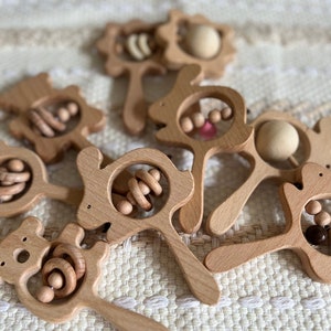 Baby toy rattle made from 100% wood with animal motifs