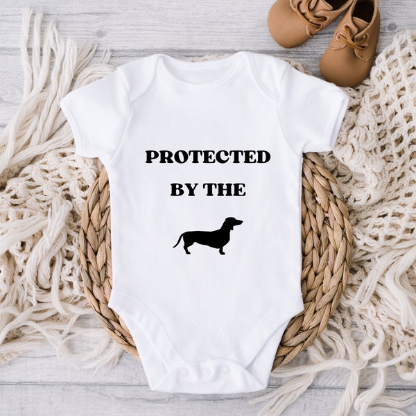 Protected by the dachsund svg for baby onsies, baby shower gift svg, funny onsies svg, gift for baby, gift for new mom, dog lover onsies