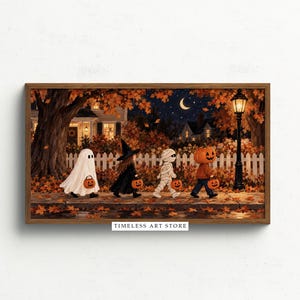 May include: A framed horizontal wall art print depicting four children in Halloween costumes walking along a sidewalk at night. The figures are dressed as a ghost, a witch, a mummy, and a pumpkin-headed character, each carrying a small orange jack-o'-lantern bucket. The scene includes a white picket fence, autumn trees, a street lamp, and a crescent moon. The text TIMELESS ART STORE is printed at the bottom center.