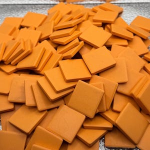 Orange ceramic mosaic tiles for crafting and decorating