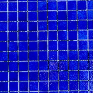 Blue ceramic mosaic tiles as a mat for crafting and decorating