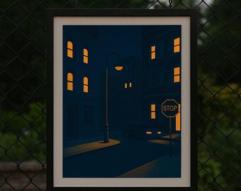 Könnte beinhalten: Gerahmter Kunstdruck, der eine nächtliche Straßenszene zeigt. Das Kunstwerk zeigt Gebäude mit beleuchteten Fenstern, eine Straßenlaterne und ein Stoppschild. Die Farbpalette wird von dunklen Blau- und Orangetönen dominiert, was eine stimmungsvolle Atmosphäre erzeugt.