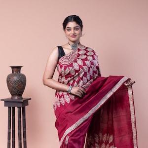 Buy this all occasion wear maroon silk saree