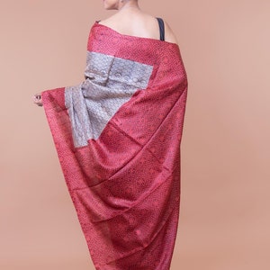 Beautiful red border beige saree.