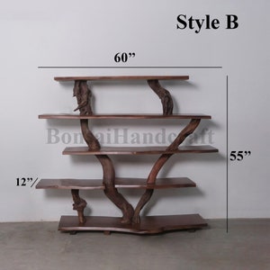 May include: A wooden shelf unit with a natural branch design. The shelf is 60 inches wide and 55 inches tall. The bottom shelf is 12 inches deep.