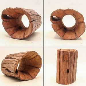 May include: Four different views of a wooden log planter. The planter is made from a natural log with the bark still on it. The log has been hollowed out to create a planter. The planter is a natural brown color.