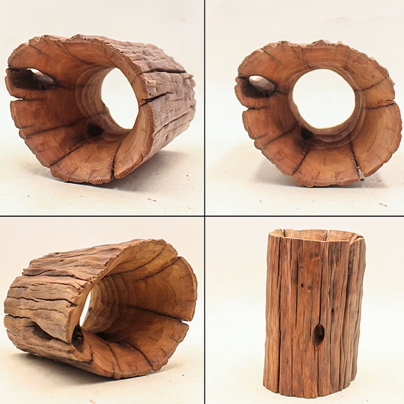 May include: Four different views of a wooden log planter. The planter is made from a natural log with the bark still on it. The log has been hollowed out to create a planter. The planter is a natural brown color.