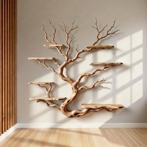 May include: A unique, wall-mounted wooden shelf in the shape of a tree. The tree-shaped shelf has multiple flat, rectangular shelves extending from the branches. The wood has a natural, light brown color, and the design adds a rustic, artistic touch to any room.