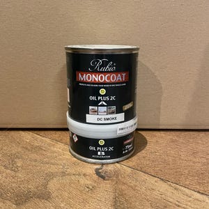May include: Two cans of Rubio Monocoat Oil Plus 2C wood finish. The top can is labeled "DC Smoke" and the bottom can is labeled "Accelerator".