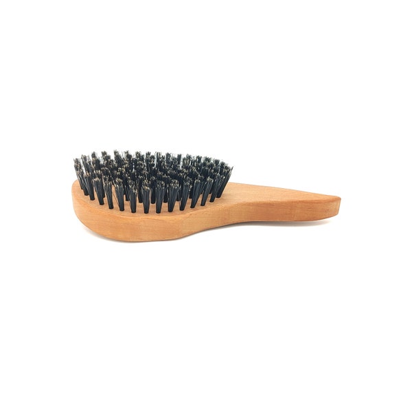 Wooden hairbrush with wild boar bristles in pear wood drop shape