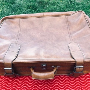 Light brown vinyl suitcase