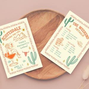 May include: Two cream-colored cards with a southwestern theme. The first card has a cactus, a woman in a cowboy hat holding a margarita, and the text "Scottsdale Before the Veil" and "Emmn's Bachelorette Weekend". The second card has a cactus and the text "The Weekend Details" with a schedule of events for Friday, Saturday, and Sunday.