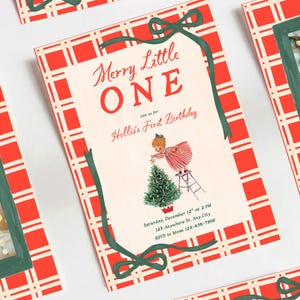 May include: A rectangular invitation card featuring a red and white plaid border with a dark green ribbon graphic. The text reads Merry Little ONE Join us for Hollis's First Birthday Saturday, December 12th at 2 PM 123 Anywhere St, Any City RSVP to Mom 123-456-7890.
