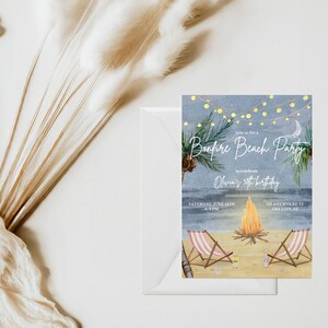 May include: A beach-themed invitation with the text "Bonfire Beach Party" and event details. The invitation features a watercolor illustration of a bonfire, beach chairs, and palm trees under a starry sky. The invitation is inside a white envelope.