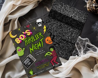 May include: A Halloween-themed invitation with pixelated graphics, featuring the text "80's Thriller Night." The invitation includes a green ghost, a jack-o'-lantern, and a zombie. A black and gray patterned fabric and white fabric are draped around the invitation.