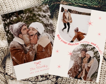 May include: Holiday greeting cards featuring winter scenes and the text "May your days be merry and bright." One card shows a couple laughing in the snow, and the other shows a couple playing in the snow. The cards are on a knitted blanket.