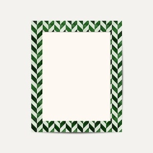 May include: A rectangular picture frame with a white interior and a green and white chevron pattern border. The frame is a decorative element, suitable for displaying photos or artwork. The design is modern and geometric.