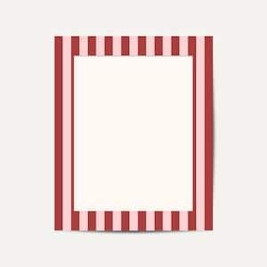 May include: A rectangular frame with a cream-colored center and a border of alternating red and light pink vertical stripes. The frame is set against a plain, off-white background.
