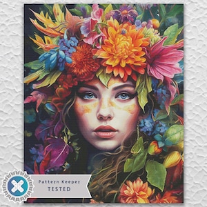 Puede incluir: Un retrato vibrante de una mujer adornada con una corona floral. La obra de arte presenta a una mujer con ojos azules y una colorida disposición de flores en tonos naranja, rosa, azul y amarillo. El texto "Pattern Keeper TESTED" es visible en la parte inferior.