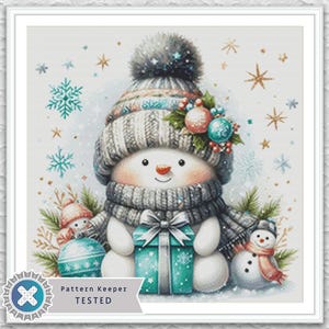 May include: Watercolor illustration of a snowman wearing a gray knit hat and scarf, holding a teal gift. The snowman is decorated with ornaments and surrounded by snowflakes and stars. A smaller snowman is on the right.