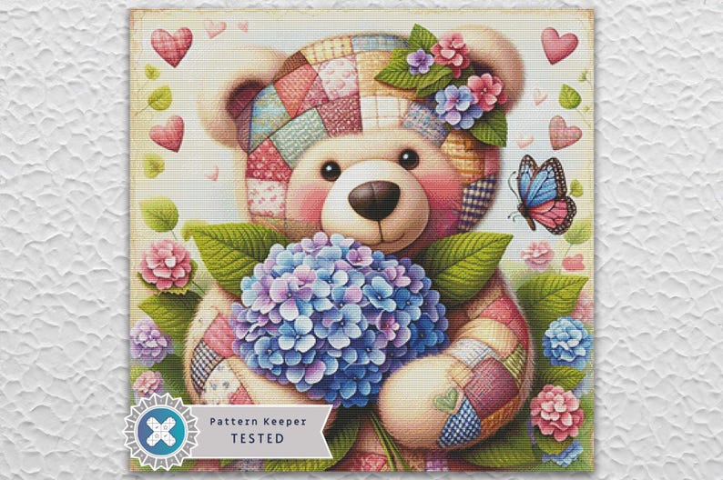May include: A charming illustration of a teddy bear clutching a bouquet of blue and purple hydrangeas. The bear features a patchwork design and floral embellishments. A butterfly and hearts enhance the vintage aesthetic. The text "Pattern Keeper TESTED" is visible.