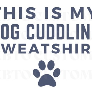 May include: A blue graphic design on a white background that says "This is my dog cuddling sweatshirt" with a paw print below the text.