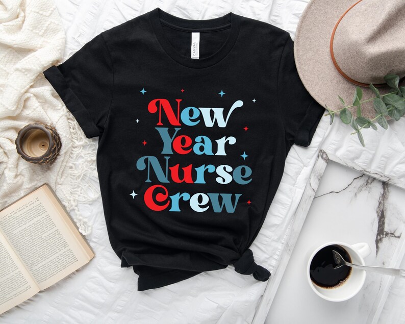 May include: Black t-shirt with the text "New Year Nurse Crew" in red, blue and white lettering. The text is in a retro font style.