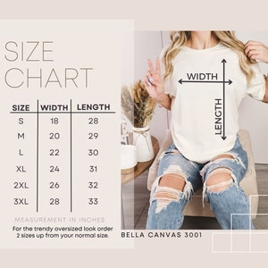 May include: Cream-colored t-shirt with a size chart showing width and length measurements in inches. The chart includes sizes S to 3XL. The text on the shirt reads "BELLA CANVAS 3001".
