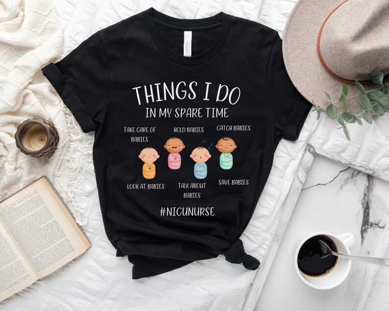 May include: Black t-shirt with white text that reads "Things I do in my spare time."  The text is surrounded by illustrations of babies in different poses.  The text "#NICUNURSE" is at the bottom of the shirt.