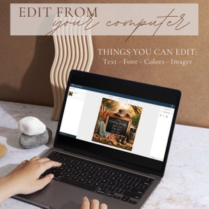 May include: A laptop computer screen displaying a digital design template for a baby shower invitation. The design features a rustic wooden sign with the text "NEW Hosting Buddies Baby Shower MAY 2024".