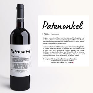 May include: A white label on a bottle of red wine with the text "Patenonkel [Philipp] Substantiv" and a description of the meaning of the word "Patenonkel".