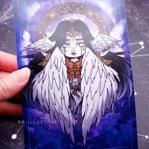 May include: A rectangular art print featuring a celestial illustration of a figure with large white wings, long black hair, and ornate gold accents. The background is a deep blue with a starry pattern. The text "RB-ILLUSTRATION.CO.UK" is printed at the bottom.