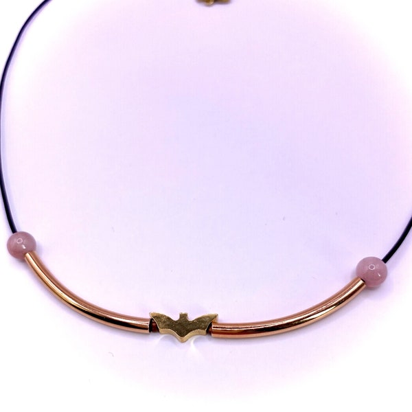 Black leather necklace with gold-colored bat pearl and pink-colored marble beads with rose gold tube beads